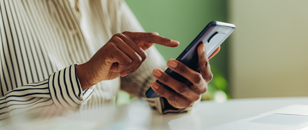 Close-up of a person's hands holding a smartphone